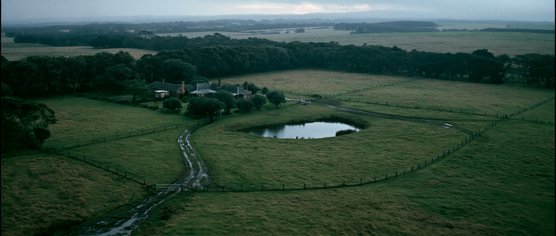 Aerial view of Cameron farmhouse and paddocks at dusk